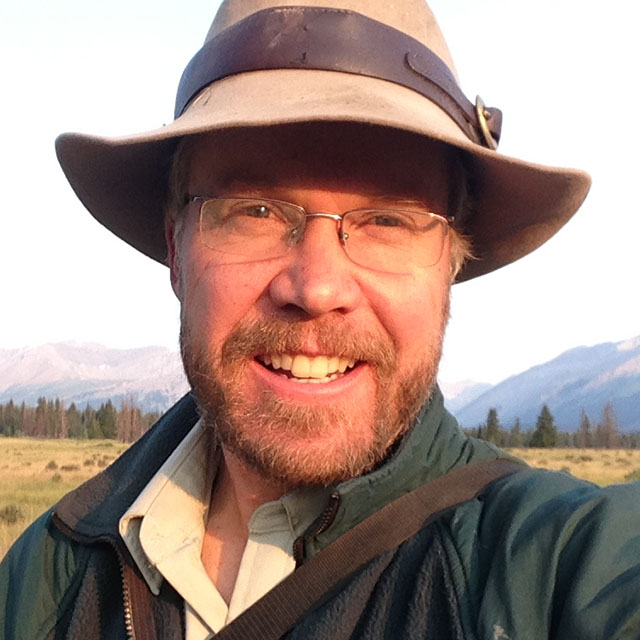 A headshot photo of Karsten Heuer in a Parks Canada uniform.