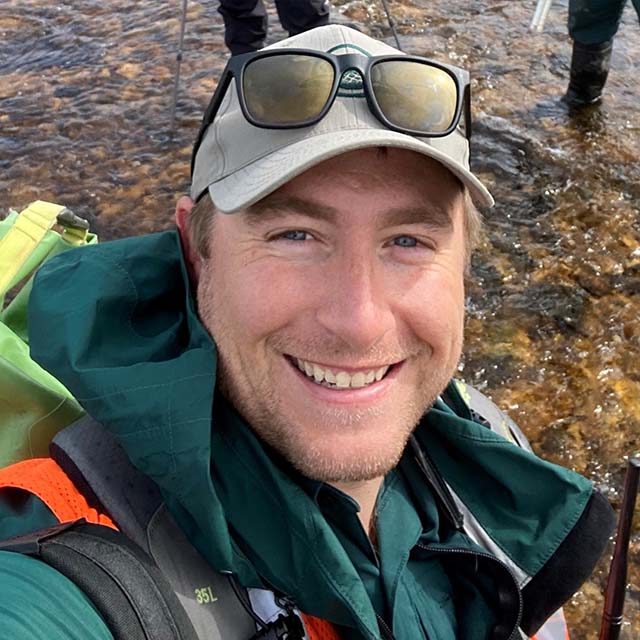 A headshot photo of Russell Turner wearing a Parks Canada uniform.
