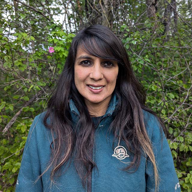 A headshot photo of Ramona Maraj wearing a Parks Canada uniform.